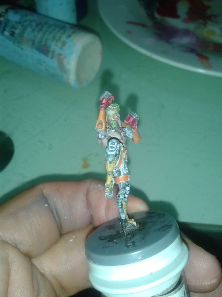 One of my miniatures glued on an empty glucose test strips container, improvising a miniature painting handles/holders